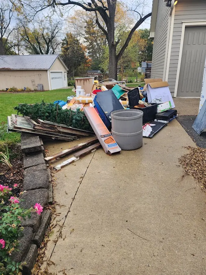 Dumpster being loaded with debris for Estate Cleanout Dumpster Rental in Boerne